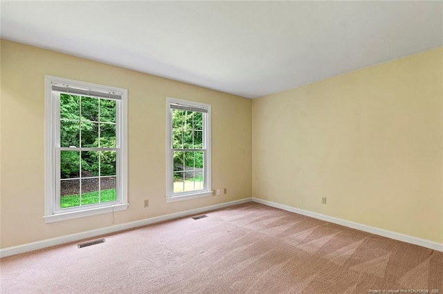 1718 Carthage St, Sanford, NC 27330 - carpeted empty room with baseboards
