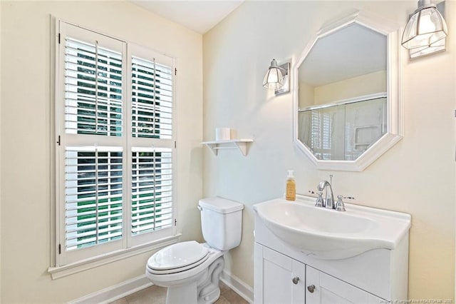 1718 Carthage St, Sanford, NC 27330 - bathroom featuring plenty of natural light, baseboards, vanity, and toilet