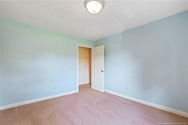 1718 Carthage St, Sanford, NC 27330 - carpeted spare room with baseboards