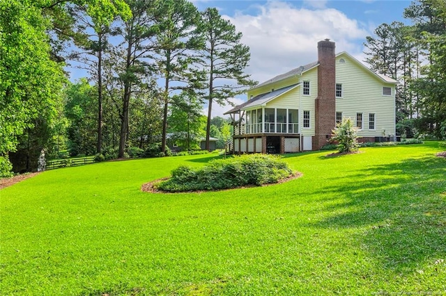 1718 Carthage St, Sanford, NC 27330 - view of grassy yard with a sunroom