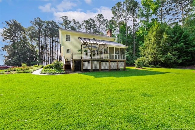 1718 Carthage St, Sanford, NC 27330 - rear view of house featuring stairs, a chimney, a deck, and a yard