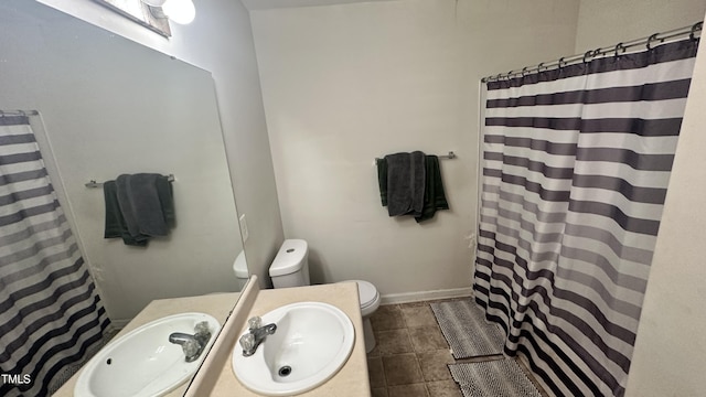 6005 Namozine Ct, Raleigh, NC 27610 - bathroom with toilet, a shower with curtain, and vanity