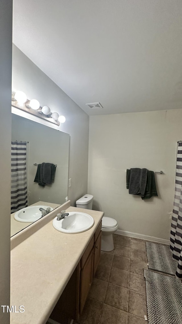 6005 Namozine Ct, Raleigh, NC 27610 - full bath featuring vanity, toilet, baseboards, and a shower with shower curtain