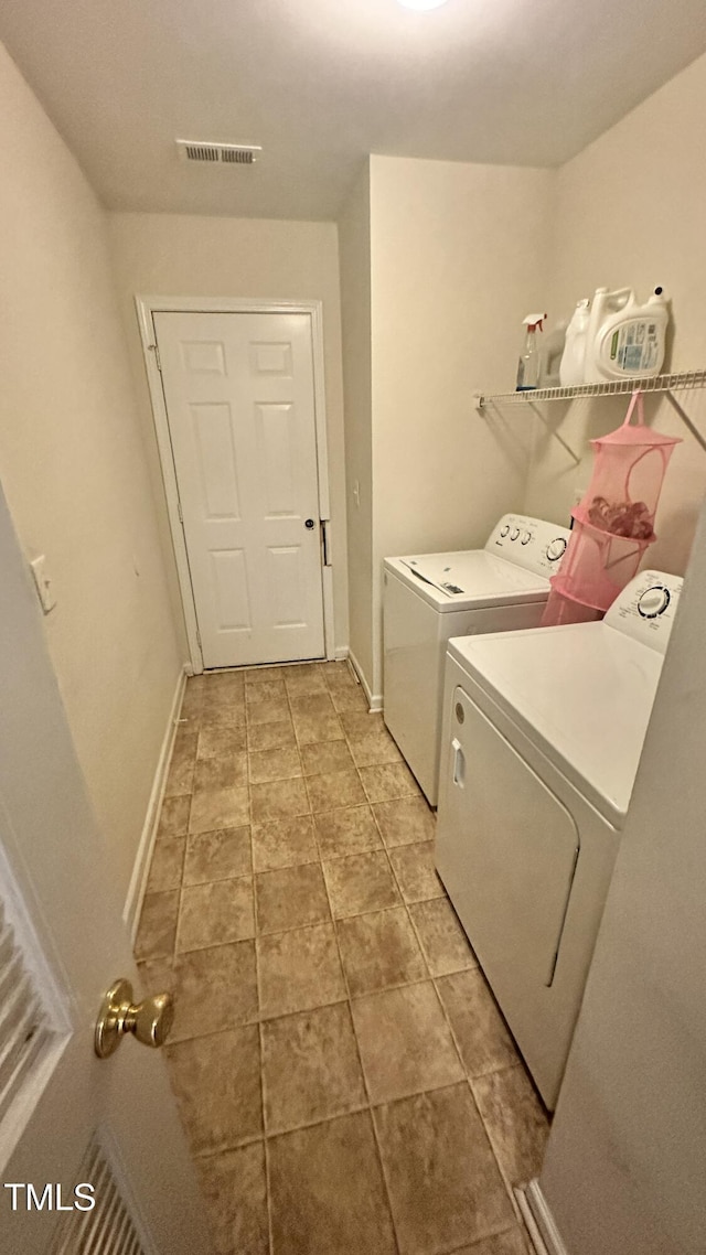 6005 Namozine Ct, Raleigh, NC 27610 - washroom featuring washer and clothes dryer and baseboards