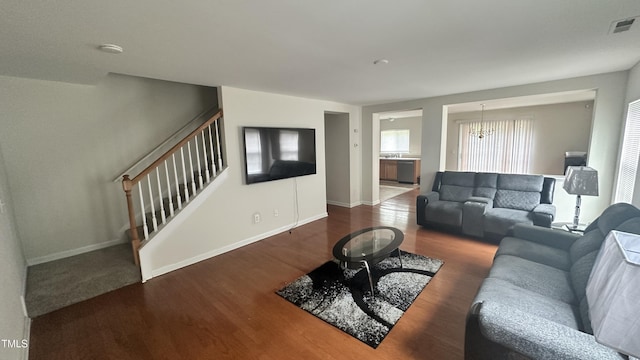 6005 Namozine Ct, Raleigh, NC 27610 - living area with stairs, wood finished floors, and baseboards