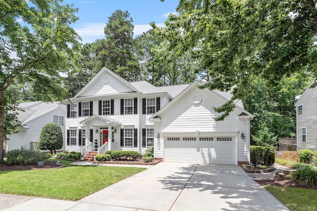 2422 Castleburg Dr, Apex, NC 27523 - colonial-style house featuring driveway, a garage, and a front yard