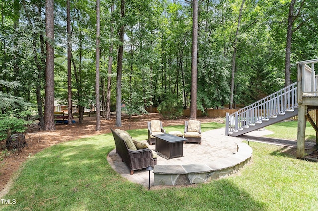 2422 Castleburg Dr, Apex, NC 27523 - view of grassy yard with stairs, a patio, and an outdoor fire pit