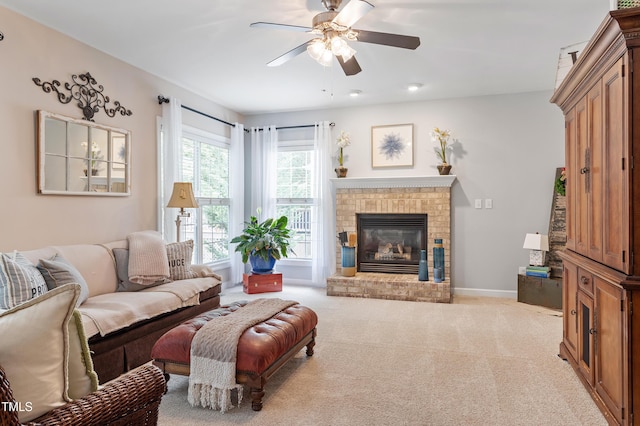2422 Castleburg Dr, Apex, NC 27523 - carpeted living room featuring a ceiling fan and a brick fireplace