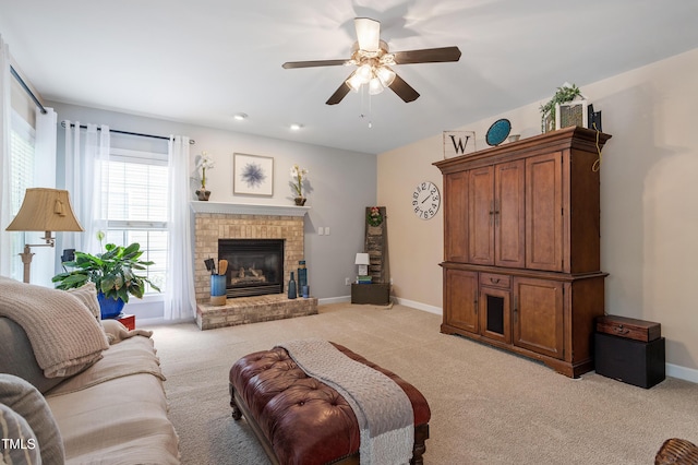 2422 Castleburg Dr, Apex, NC 27523 - living room with a ceiling fan, light carpet, and a fireplace