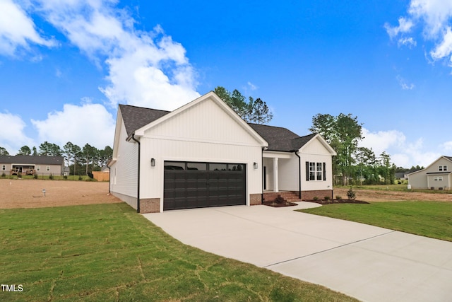 162 Gumtop Dr, Zebulon, NC 27597 - modern farmhouse style home with a garage, driveway, a front lawn, and a shingled roof