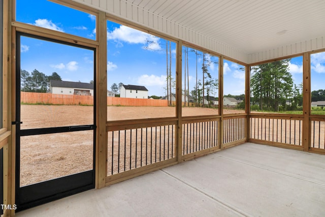 162 Gumtop Dr, Zebulon, NC 27597 - unfurnished sunroom with a residential view