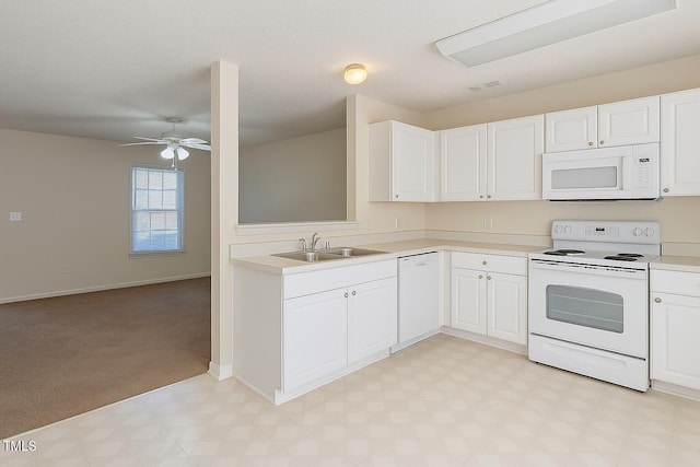 5100 Mass Rock Dr, Raleigh, NC 27610 - kitchen with white appliances, light countertops, light flooring, ceiling fan, and white cabinets