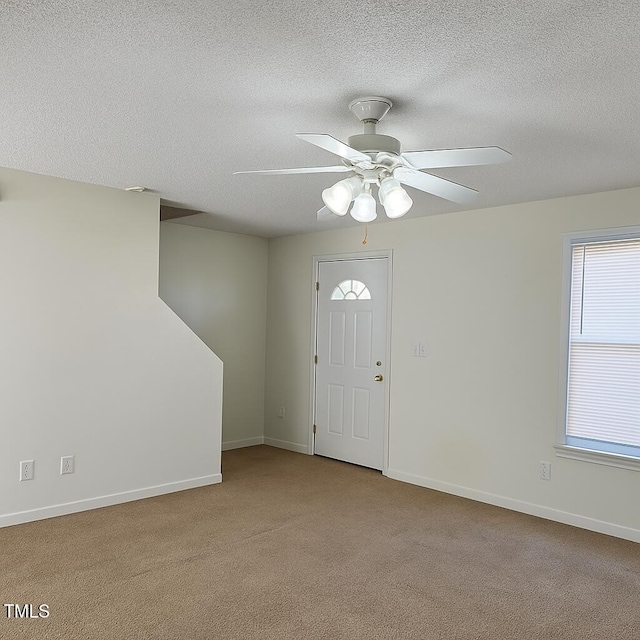 5100 Mass Rock Dr, Raleigh, NC 27610 - carpeted foyer entrance featuring a textured ceiling and ceiling fan