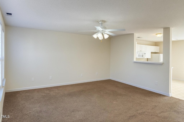 5100 Mass Rock Dr, Raleigh, NC 27610 - carpeted spare room with ceiling fan and a textured ceiling