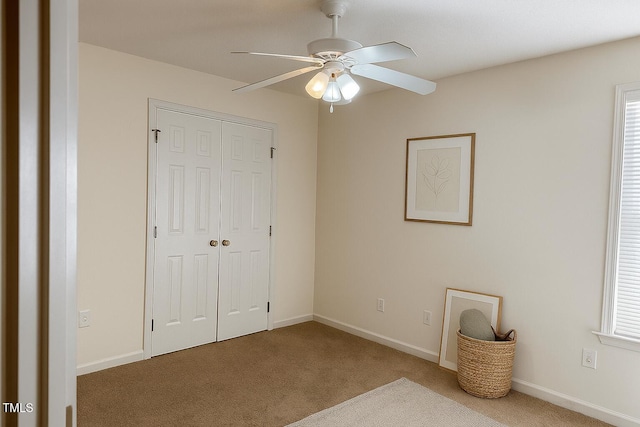 5100 Mass Rock Dr, Raleigh, NC 27610 - unfurnished bedroom with carpet, a closet, and a ceiling fan