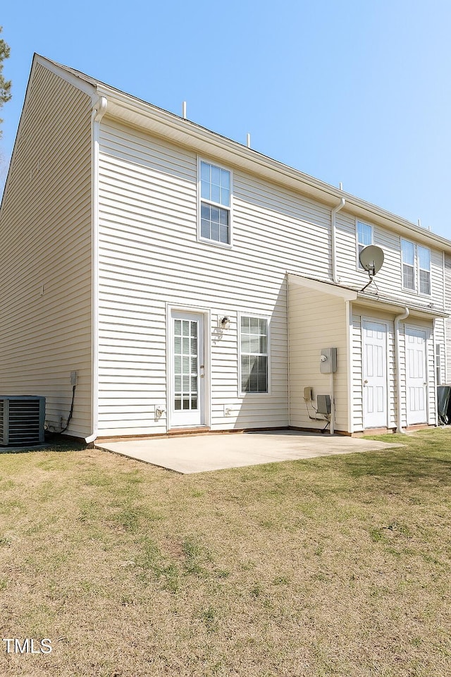 5100 Mass Rock Dr, Raleigh, NC 27610 - back of property with a patio area and a lawn
