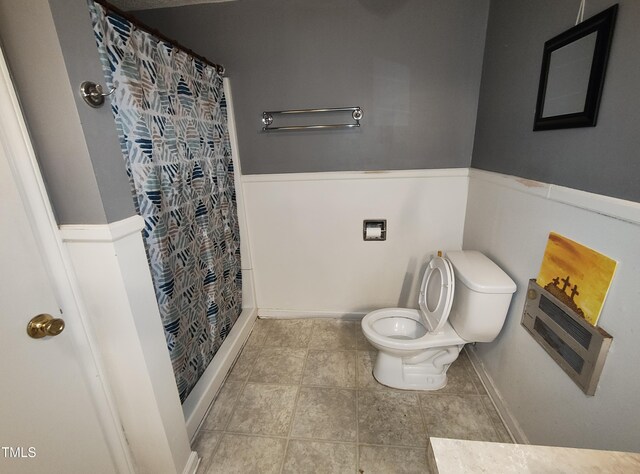 339 E Meadow Rd, Eden, NC 27288 - full bathroom with a wainscoted wall, toilet, and a shower with shower curtain