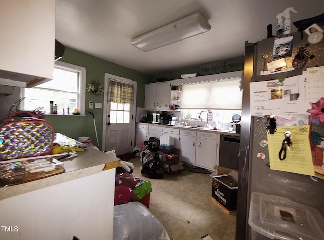 339 E Meadow Rd, Eden, NC 27288 - kitchen with freestanding refrigerator, open shelves, a sink, and white cabinetry