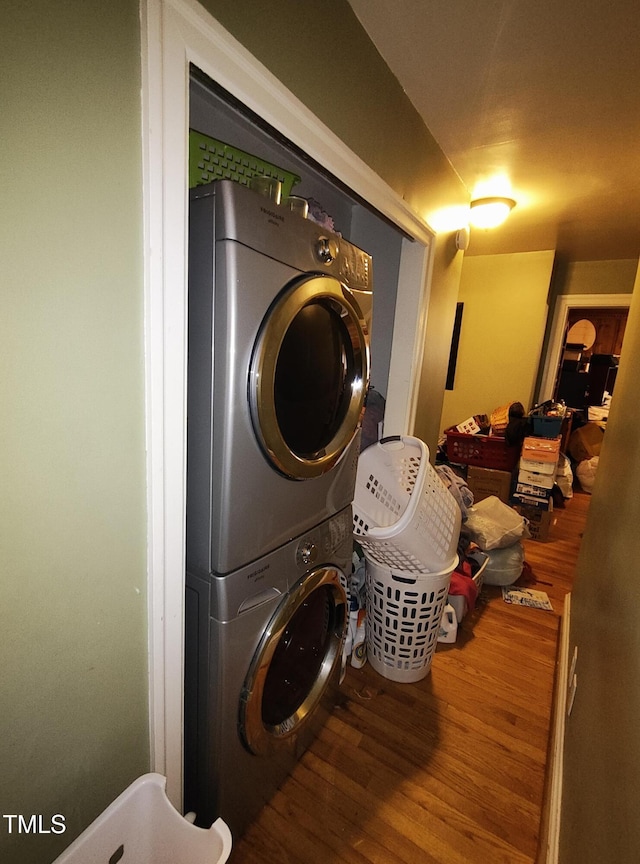339 E Meadow Rd, Eden, NC 27288 - washroom featuring stacked washer and clothes dryer and wood finished floors