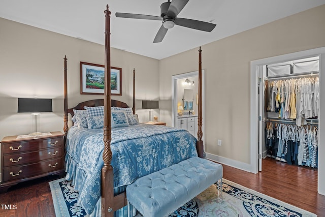 515 N Churton St Unit 203, Hillsborough, NC 27278 - bedroom featuring a walk in closet, dark wood-type flooring, baseboards, a closet, and ensuite bathroom