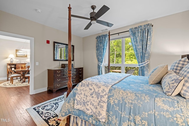 515 N Churton St Unit 203, Hillsborough, NC 27278 - bedroom with dark wood finished floors, baseboards, and ceiling fan