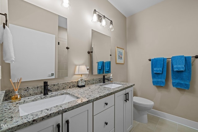 515 N Churton St Unit 203, Hillsborough, NC 27278 - bathroom featuring toilet, double vanity, tile patterned floors, and baseboards