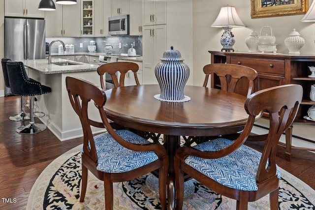 515 N Churton St Unit 203, Hillsborough, NC 27278 - dining room with dark wood-style floors and baseboards