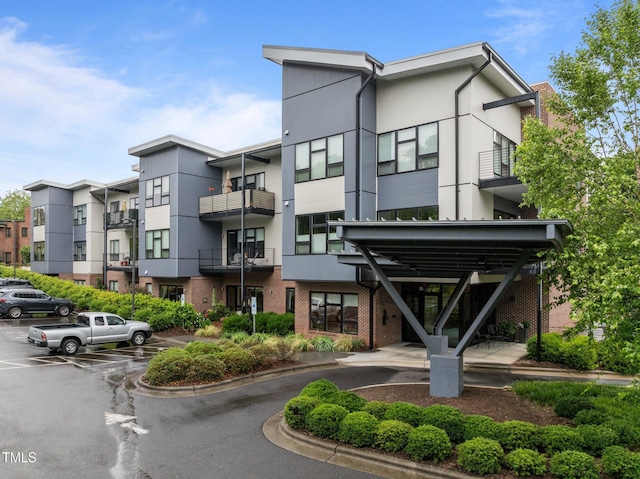 515 N Churton St Unit 203, Hillsborough, NC 27278 - view of building exterior with uncovered parking