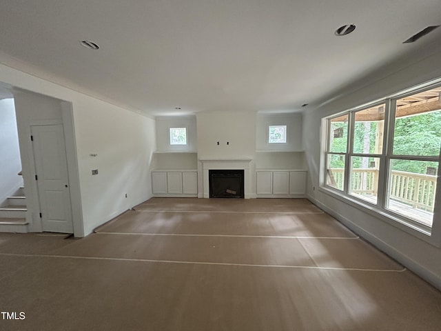 701 Locust Ln, Raleigh, NC 27603 - unfurnished living room featuring a fireplace, stairway, and recessed lighting