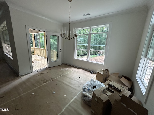 701 Locust Ln, Raleigh, NC 27603 - dining room with a chandelier and plenty of natural light