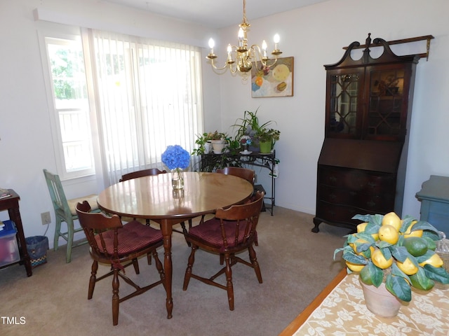 5009 Tower Rd Unit B, Greensboro, NC 27410 - dining area featuring a chandelier and light carpet