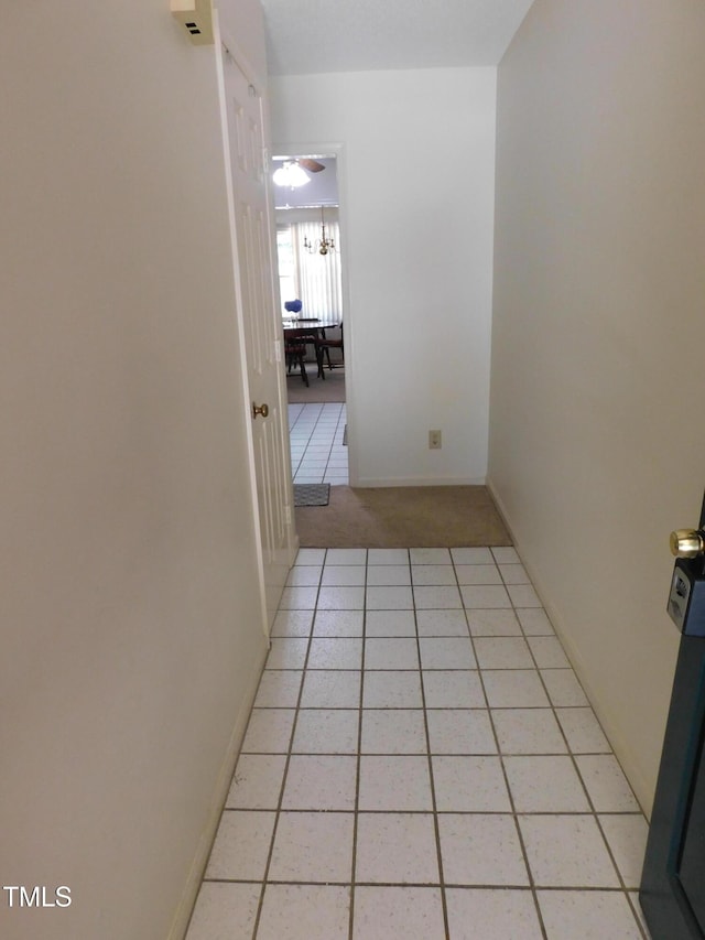 5009 Tower Rd Unit B, Greensboro, NC 27410 - corridor with light colored carpet, baseboards, and light tile patterned floors