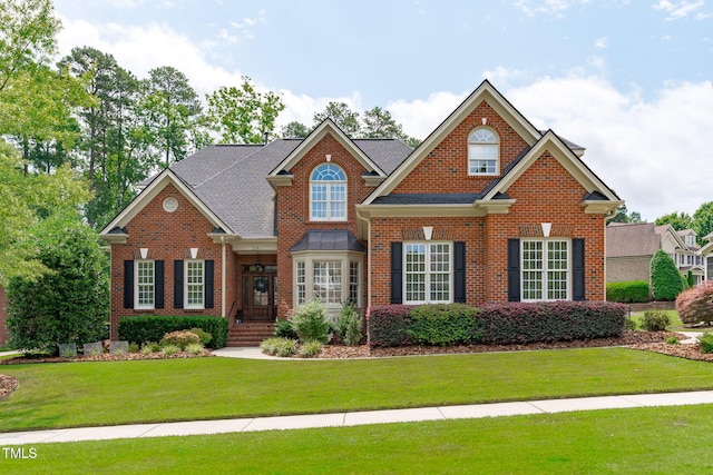 204 Franconia Way, Apex, NC 27502 - colonial house with brick siding and a front lawn