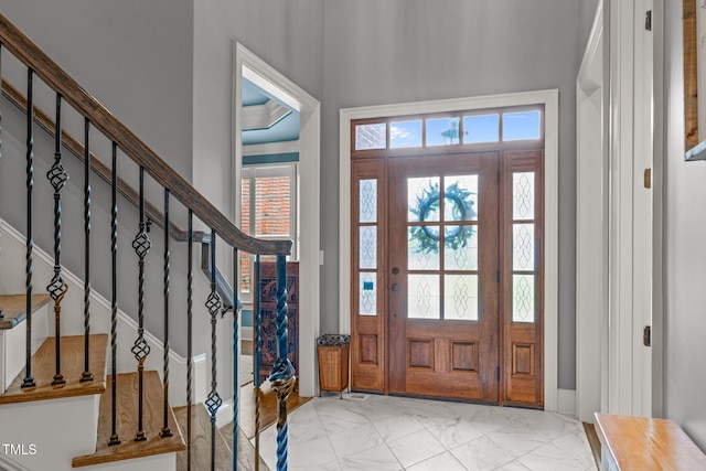 204 Franconia Way, Apex, NC 27502 - entryway featuring plenty of natural light, marble look tiles, and stairs
