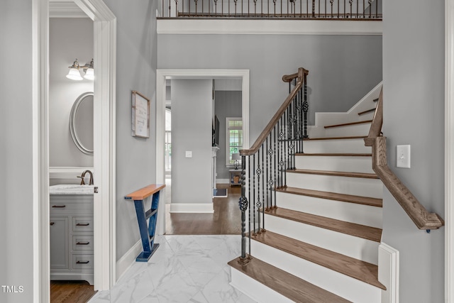 204 Franconia Way, Apex, NC 27502 - staircase featuring marble look tile flooring and baseboards