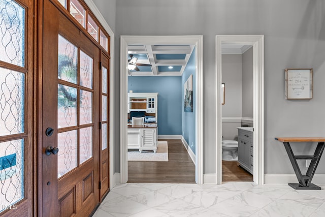 204 Franconia Way, Apex, NC 27502 - foyer entrance featuring coffered ceiling, light marble finish flooring, ornamental molding, beamed ceiling, and a ceiling fan