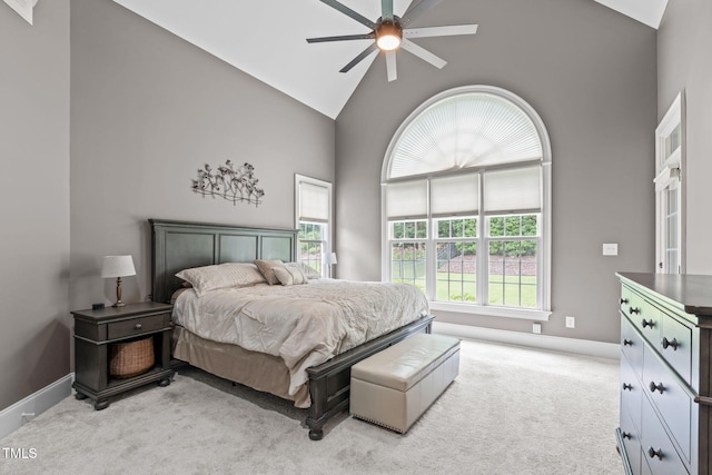 204 Franconia Way, Apex, NC 27502 - bedroom featuring multiple windows, high vaulted ceiling, light carpet, and a ceiling fan