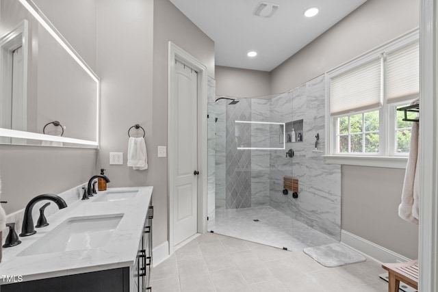 204 Franconia Way, Apex, NC 27502 - bathroom with a marble finish shower, double vanity, tile patterned floors, and recessed lighting