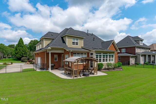204 Franconia Way, Apex, NC 27502 - back of property featuring a patio, a fenced backyard, brick siding, and a shingled roof
