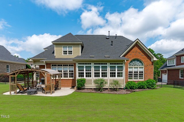 204 Franconia Way, Apex, NC 27502 - rear view of house featuring a patio, a gazebo, brick siding, and roof with shingles
