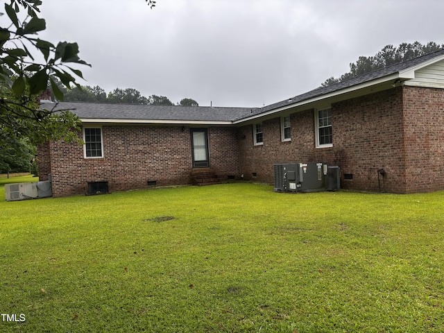 11477 NC-87, Elizabethtown, NC 28337 - rear view of property featuring crawl space, a yard, brick siding, and entry steps