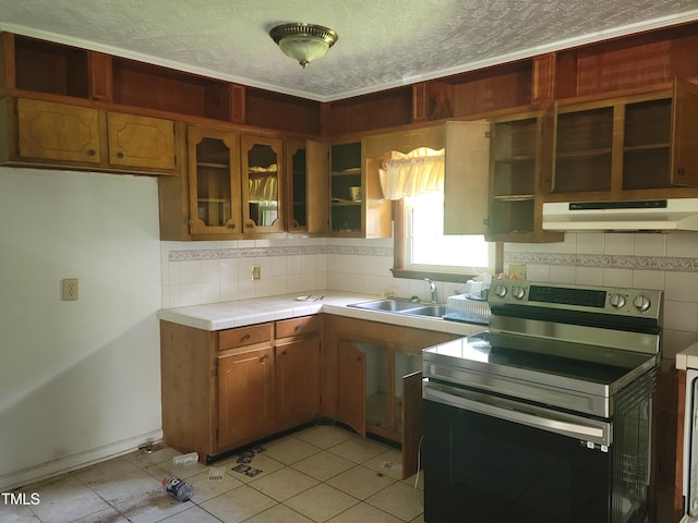 11477 NC-87, Elizabethtown, NC 28337 - kitchen featuring stainless steel electric range oven, under cabinet range hood, open shelves, tile counters, and tasteful backsplash