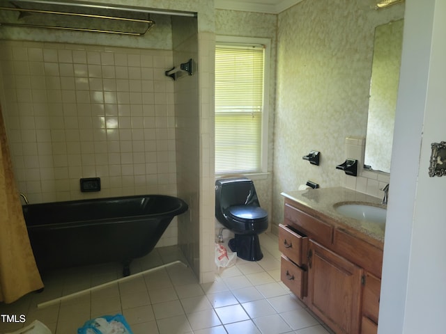 11477 NC-87, Elizabethtown, NC 28337 - bathroom featuring tile patterned floors, a freestanding bath, vanity, and wallpapered walls