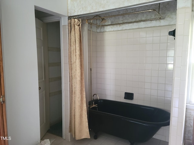 11477 NC-87, Elizabethtown, NC 28337 - bathroom with tile patterned floors and shower / bath combo