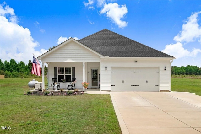 607 Laurel Lake Rd, Salemburg, NC 28385 - view of front of property featuring covered porch, a front yard, a garage, driveway, and roof with shingles