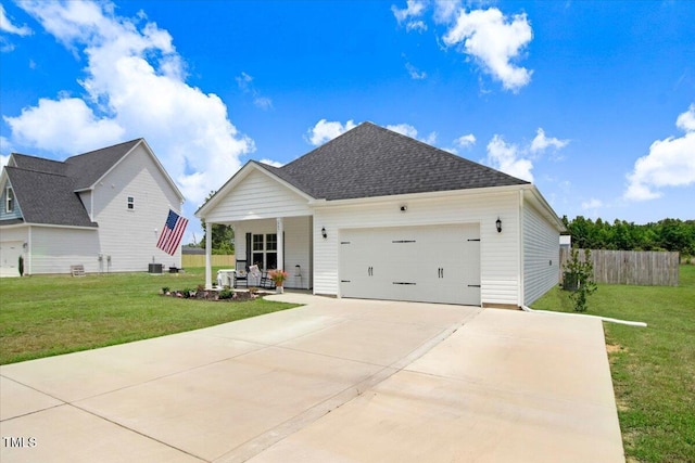 607 Laurel Lake Rd, Salemburg, NC 28385 - view of front of house with a porch, an attached garage, concrete driveway, and roof with shingles