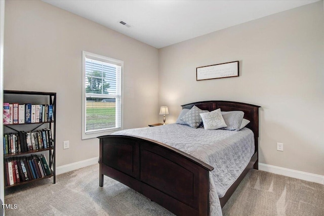 607 Laurel Lake Rd, Salemburg, NC 28385 - bedroom featuring light carpet and baseboards