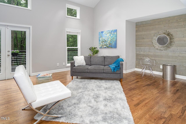 123 Becket Bnd, Pittsboro, NC 27312 - living room with a high ceiling, baseboards, french doors, and wood finished floors