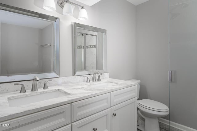 123 Becket Bnd, Pittsboro, NC 27312 - bathroom featuring double vanity, toilet, and a shower with shower door