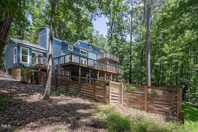 123 Becket Bnd, Pittsboro, NC 27312 - rear view of house with a wooden deck, a chimney, and stairs